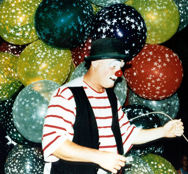 Photo of clown with balloons