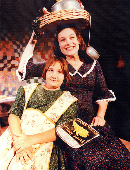 Photo of a girl with a woman wearing hat with pots and pans