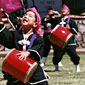 Photo of Young Taiko performer with other performers