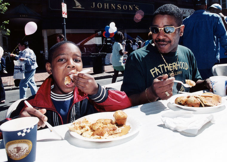 Photo of father and son eating pancakes