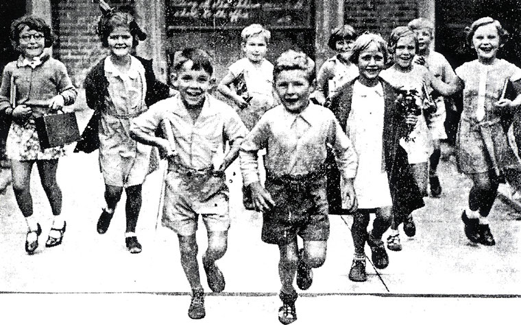 Photo of children running toward the camera