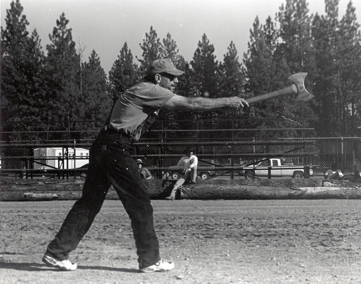 Photo of a man preparing to throw an ax