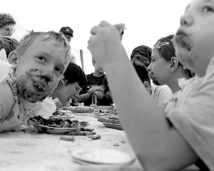 Photo of kids eating pie in a pie-eating contest