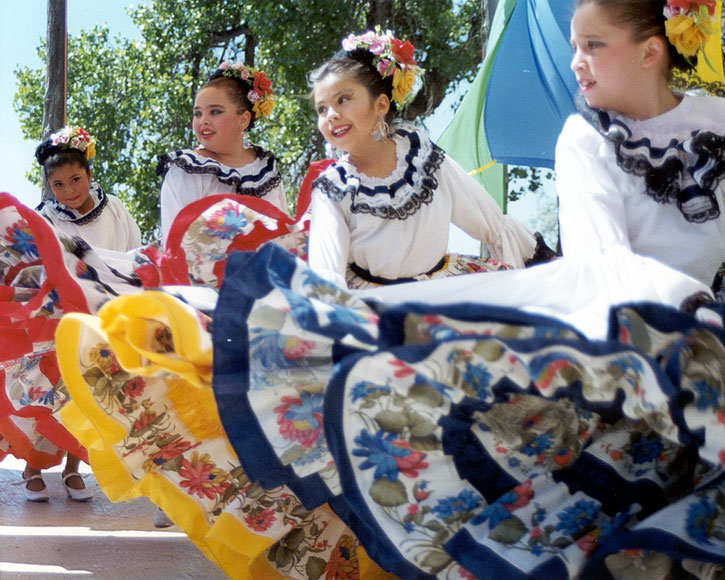 Photo of young girls dancing in costume