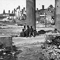 'View of Ruined Buildings through Porch of the Circular Church, Charleston, South Carolina,' April 1865.