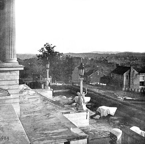 Steps of the Capitol with covered guns