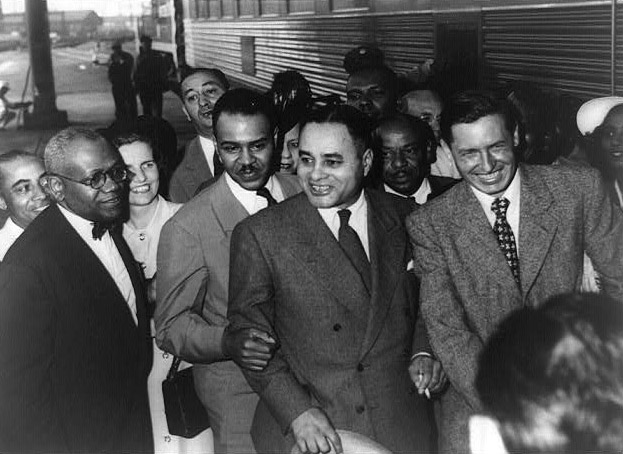 Bunche arriving at Los Angeles for convention where he received Spingarn Medal.