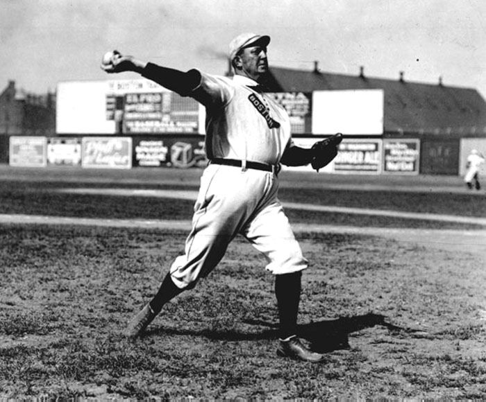 Cy Young throwing a baseball, 1908.