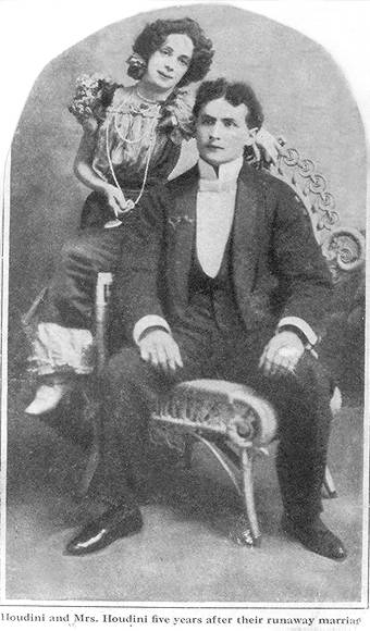 Beatrice and Harry Houdini, full-length portrait, seated, facing front, 1899.