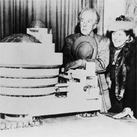 Frank Lloyd Wright, Baroness Hilla Rebay, and Solomon R. Guggenheim standing beside a model of the Solomon R. Guggenheim Museum, 1947