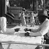 Making a Quilt from Surplus Commodity Cotton, 1941.