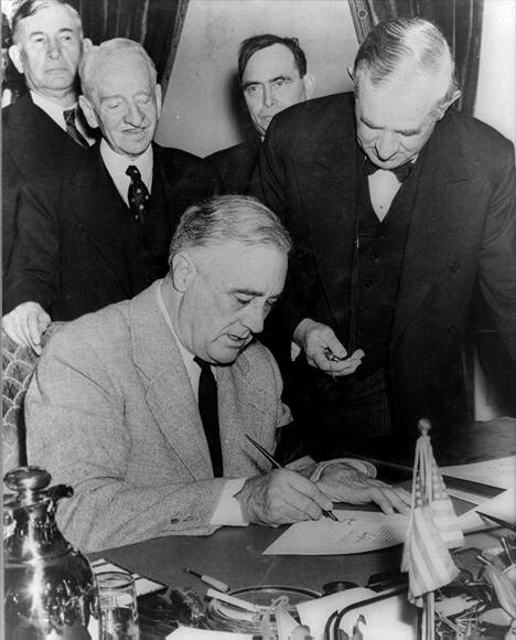 President Roosevelt Signing the Declaration of War Against Japan, 1941.