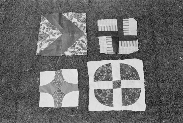 A group of four blocks made up of smaller pieces