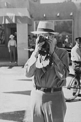 Tourist using candid camera, Taos, New Mexico, 1940.