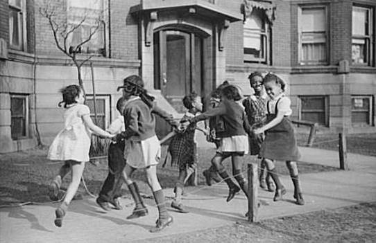 Children playing 'ring around a rosie' in Chicago, 1941.