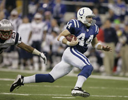 This American football player is running with, or carrying, the ball