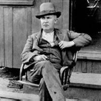 Photo of Edison Sitting at the Door of the Ore-milling Plant; Ogdensburg, NJ, 1895.