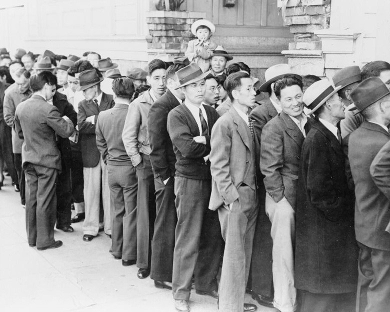 Photo of men registering for relocation in San Francisco, 1942