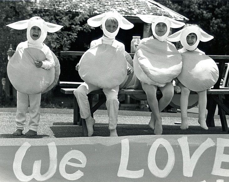 Photo of four children performing in lamb costumes