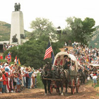 Photo of a re-enactment of Mormon pioneers arriving in Salt Lake Valley