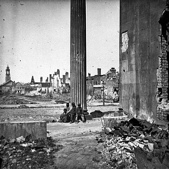 'View of Ruined Buildings through Porch of the Circular Church, Charleston, South Carolina,' April 1865.