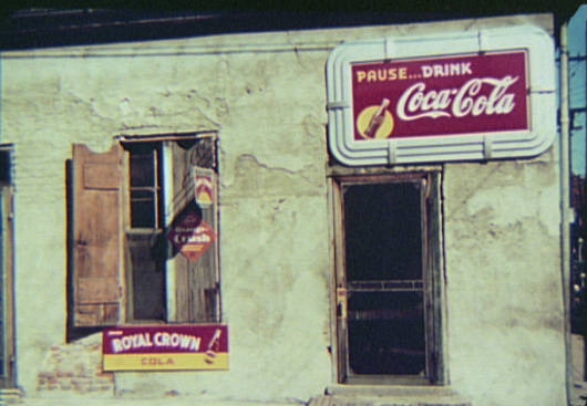 Natchez, Miss. Store or cafe with soft drink signs.