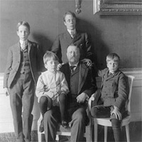 Theodore Roosevelt, full-length portrait, with his four sons posed around him