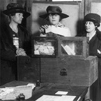 Three suffragists casting votes, 1917