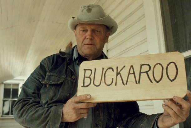 Les Stewart with Sign Made for Exhibit