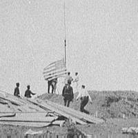 Hoisting the flag at Guantanamo, June 12, 1898.