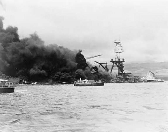 U.S.S. Arizona at height of fire, following Japanese aerial attack on Pearl Harbor, Hawaii.